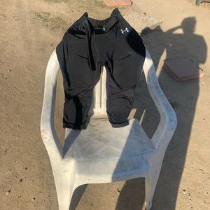 Youth black football girdle with five pads by Under Armour. Size youth XL.